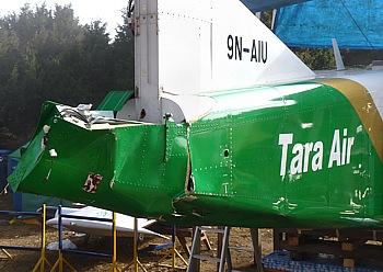 crashed aircraft of the Yeti (Tara) Air laying on the runway in Syangboche