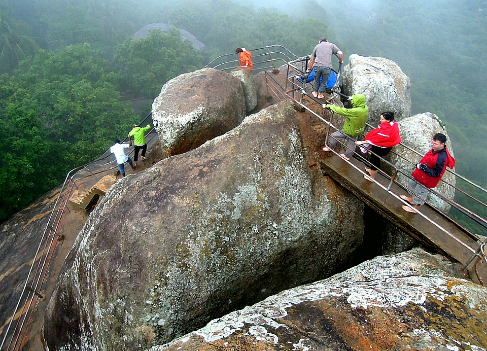 Climbing up Mihintale rock in heavy rain