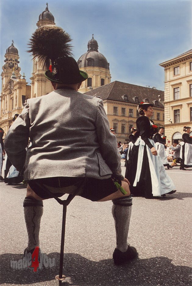 Performer in traditional bavarian costume at Odeonsplatz
