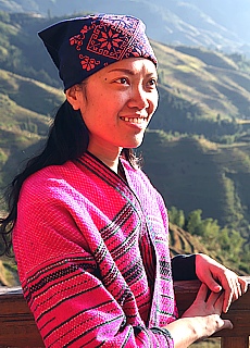 Woman in traditional dress in the rice terraces of Longsheng