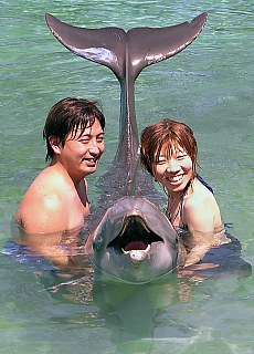 Smiling with dolphin for the photoalbum