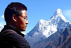 Sherpa in front of the holy mountain Ama Dablam
