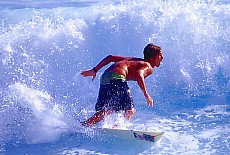 Wave surfer at Boucan Canot beach