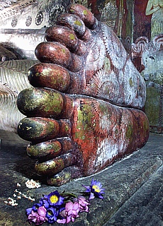 Buddhas feet in Cave temple Dambulla